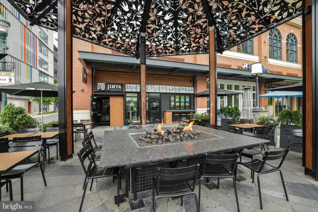 a view of an outside dining space with furniture