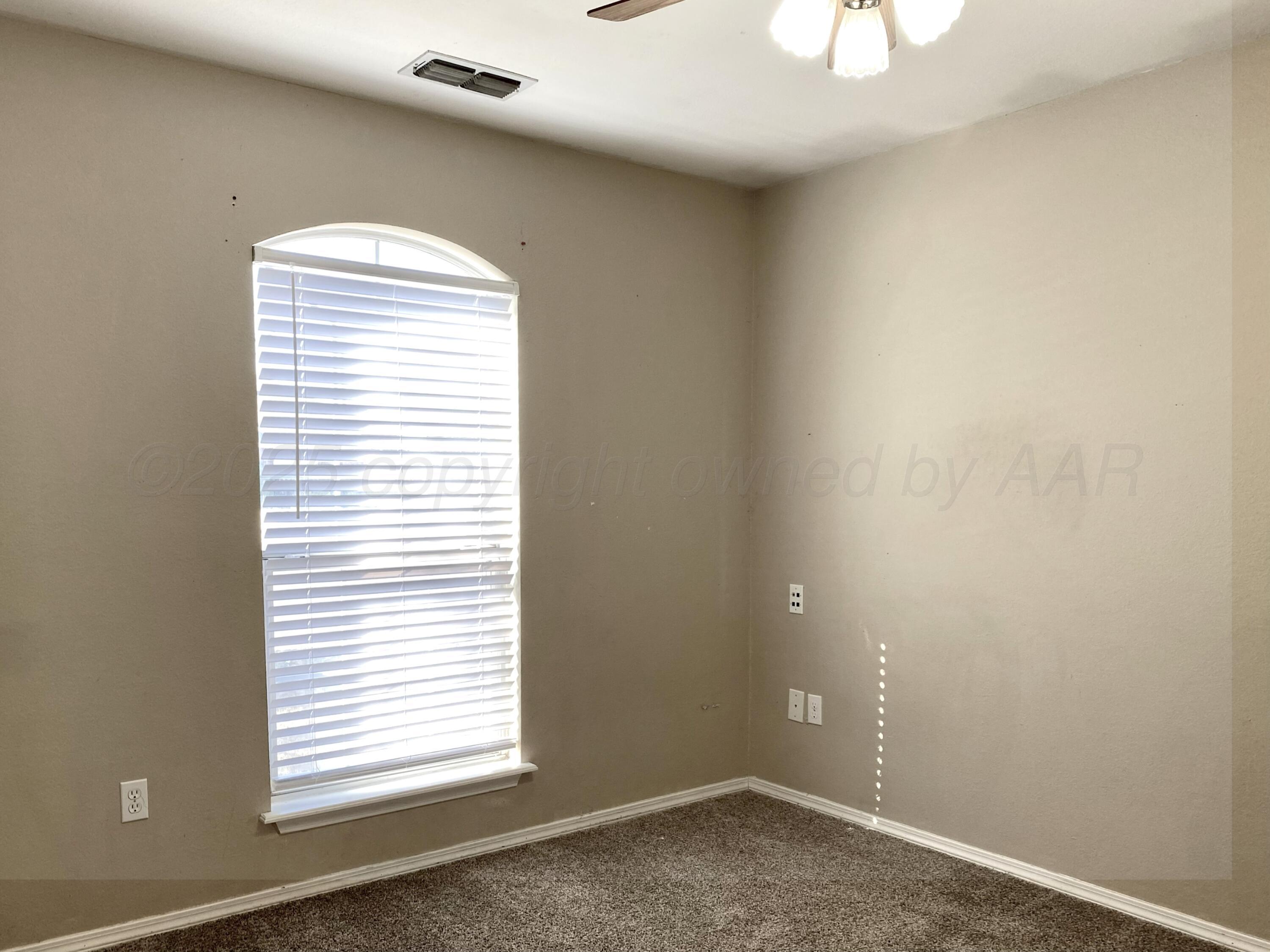 7903 Goal Place Amarillo, TX 79119 - Photo 11 of 14 an empty room with a window