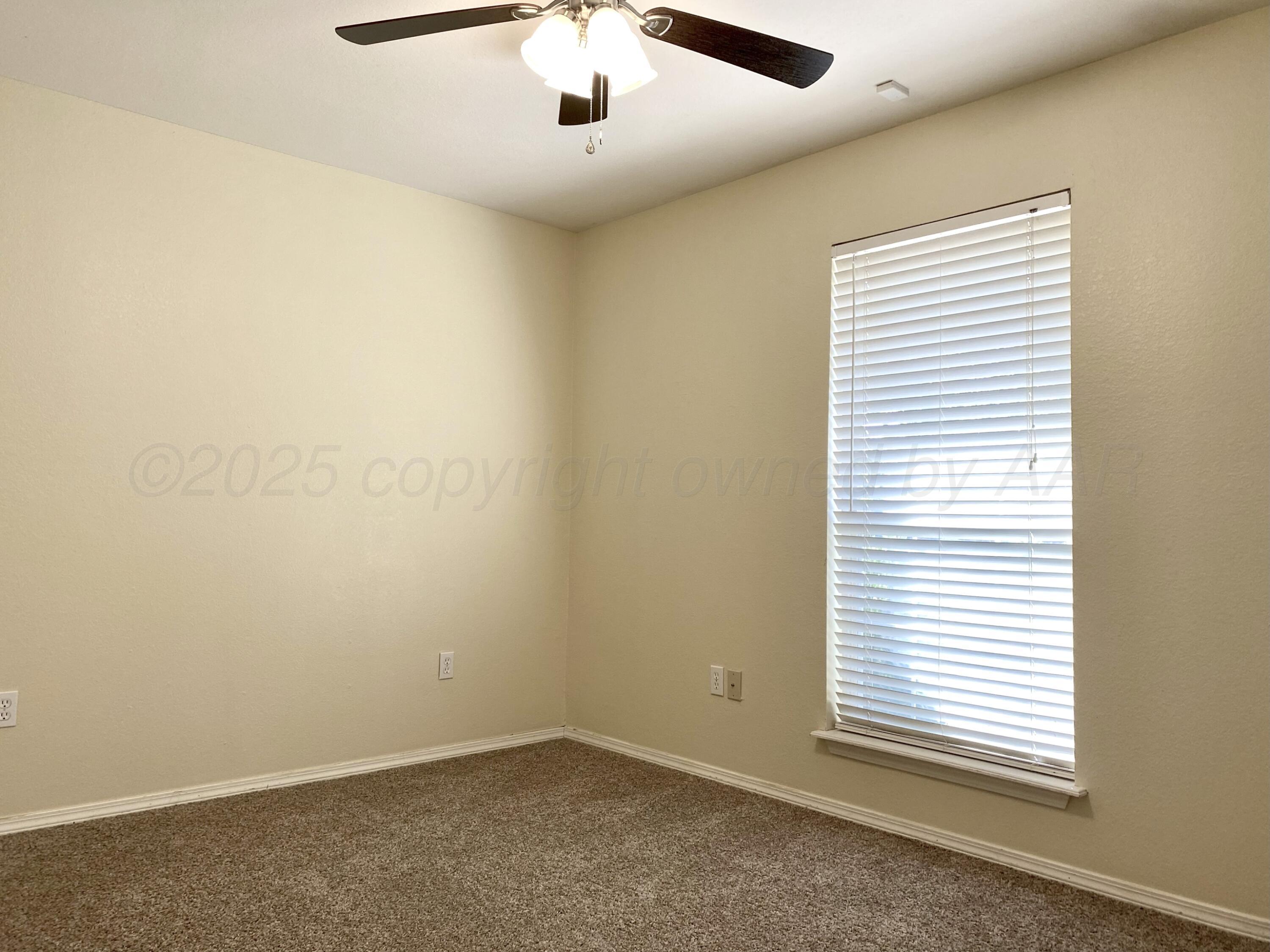 7903 Goal Place Amarillo, TX 79119 - Photo 14 of 14 an empty room with a window