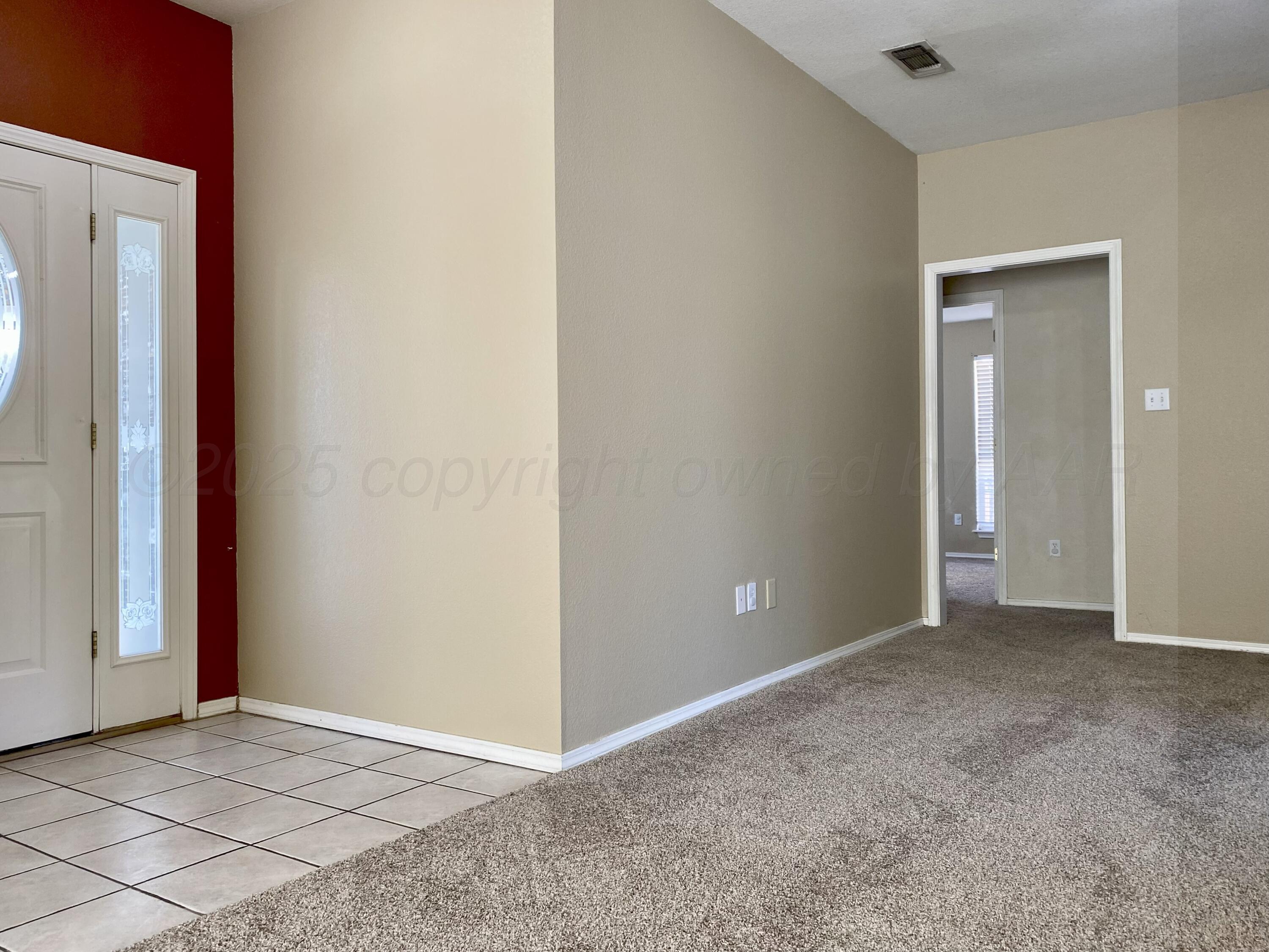 7903 Goal Place Amarillo, TX 79119 - Photo 3 of 14 a view of an empty room with window