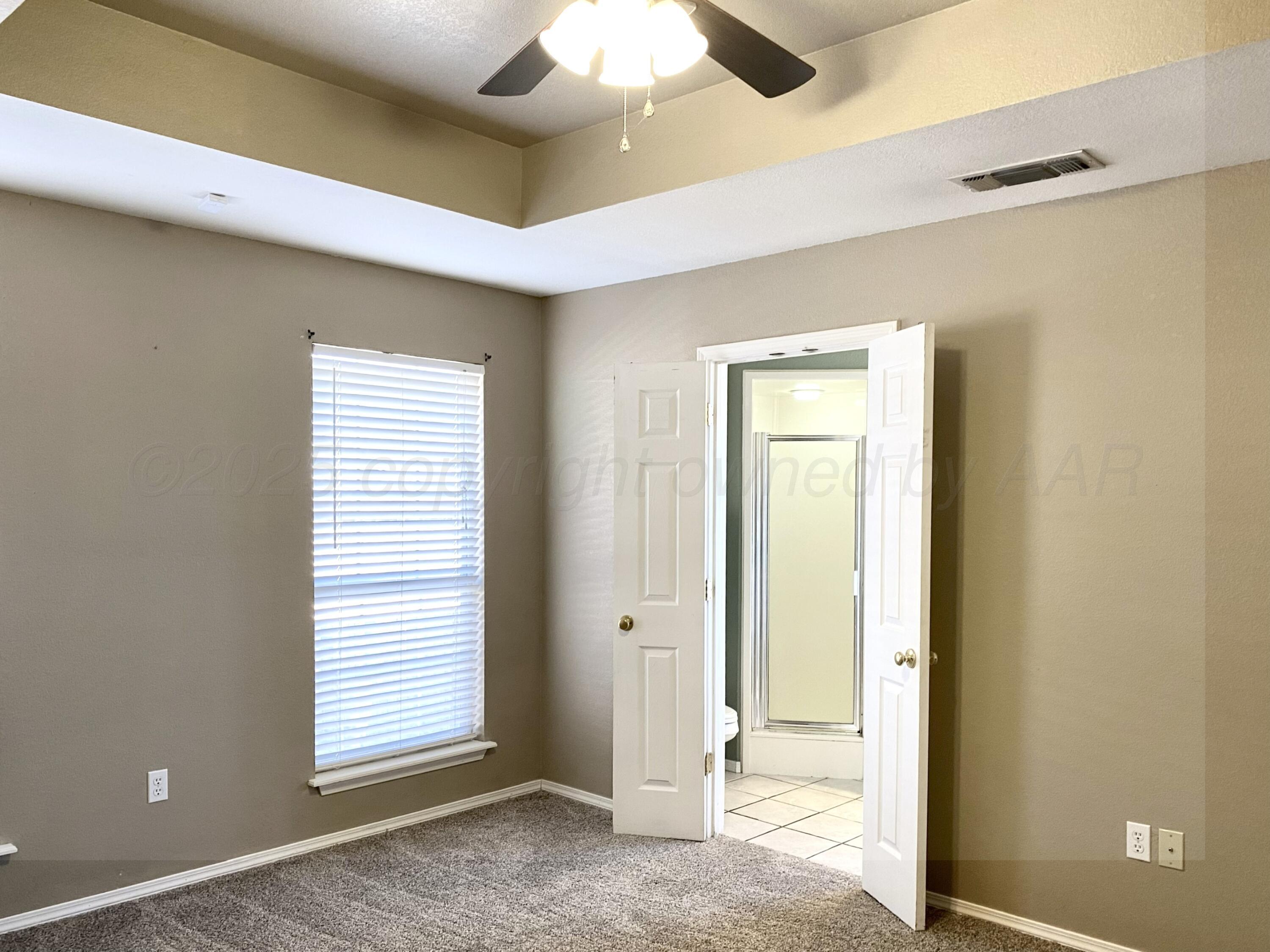 7903 Goal Place Amarillo, TX 79119 - Photo 8 of 14 an empty room with windows and closet