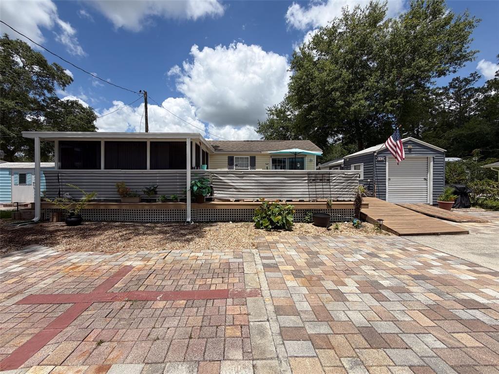 2092 Culbreath Road, Unit A42 Brooksville, FL 34602 - Photo 3 of 70 a view of a house with chairs in the patio
