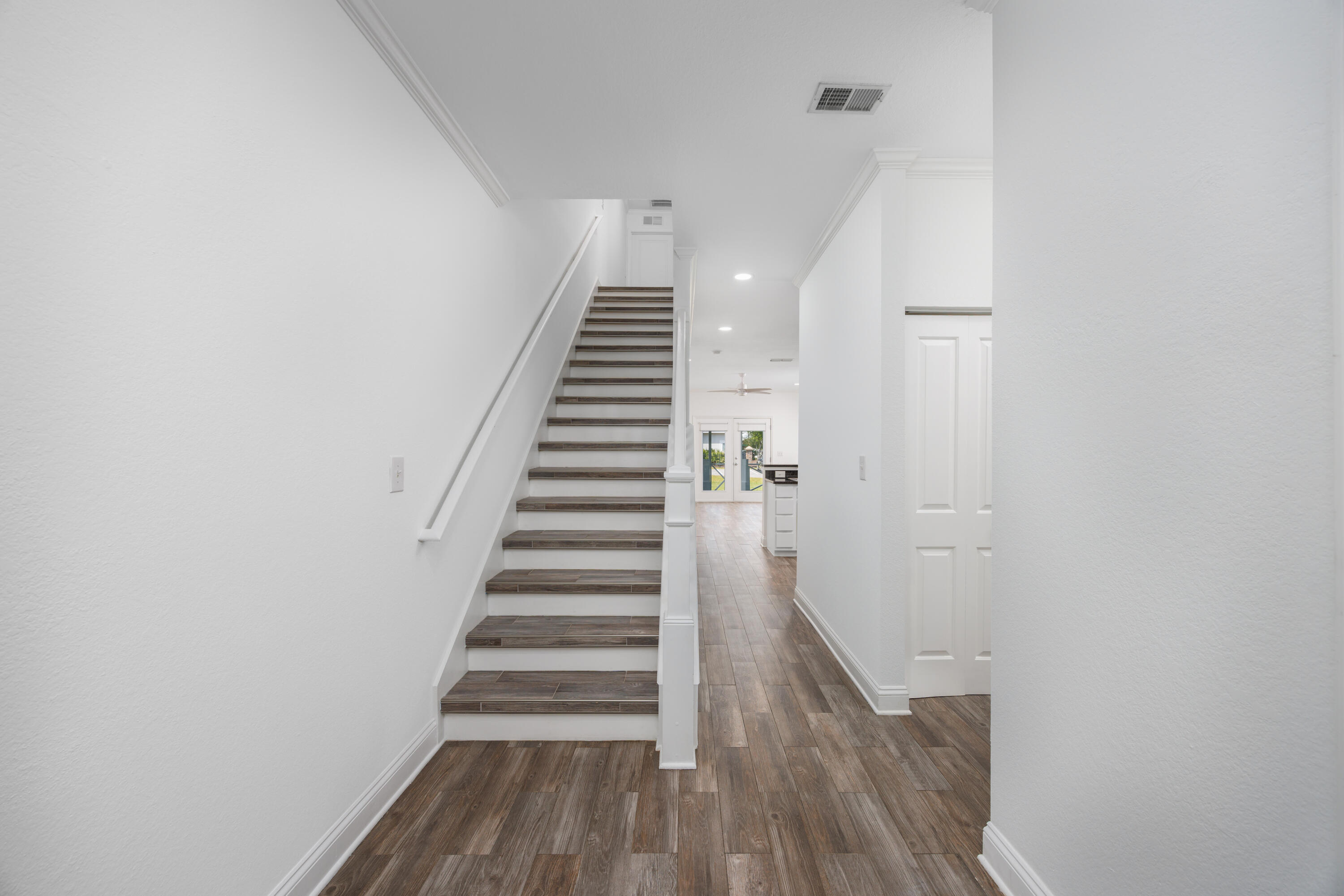 16 South Sand Palm Road Freeport, FL 32439 - Photo 12 of 32 a view of entryway with wooden floor