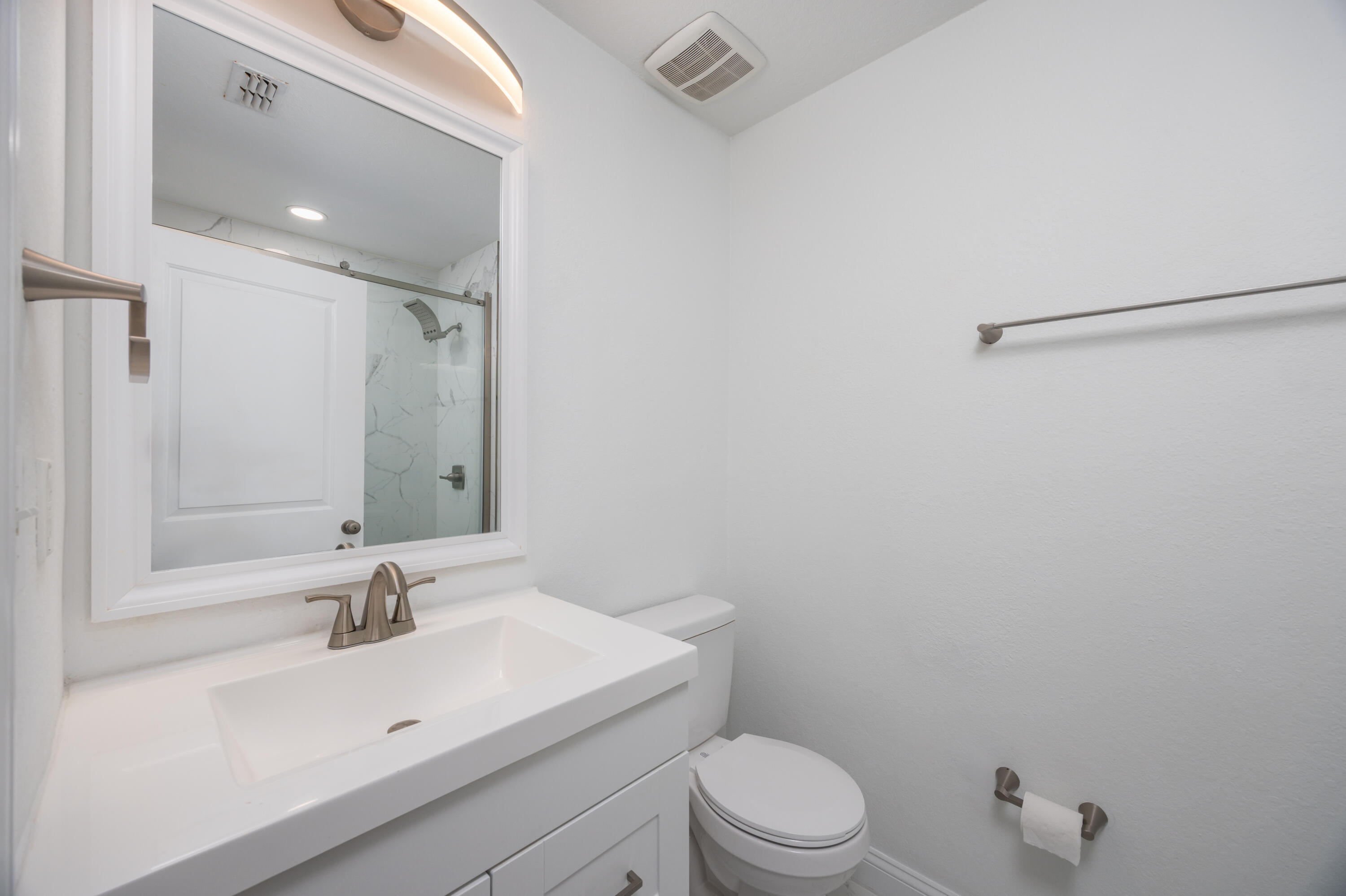 16 South Sand Palm Road Freeport, FL 32439 - Photo 14 of 32 a bathroom with a sink a toilet and shower