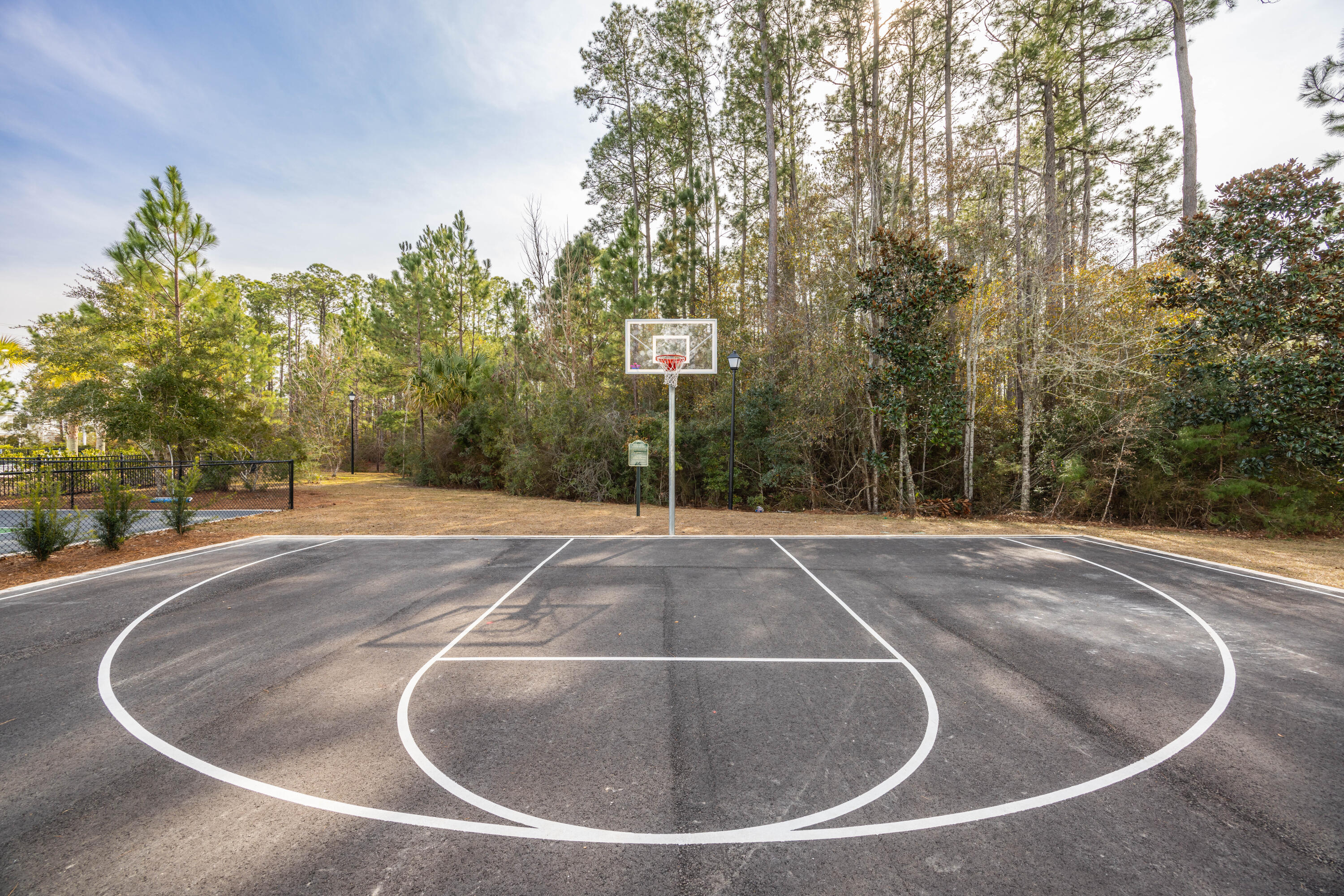 16 South Sand Palm Road Freeport, FL 32439 - Photo 23 of 32 a view of a playground with basketball court