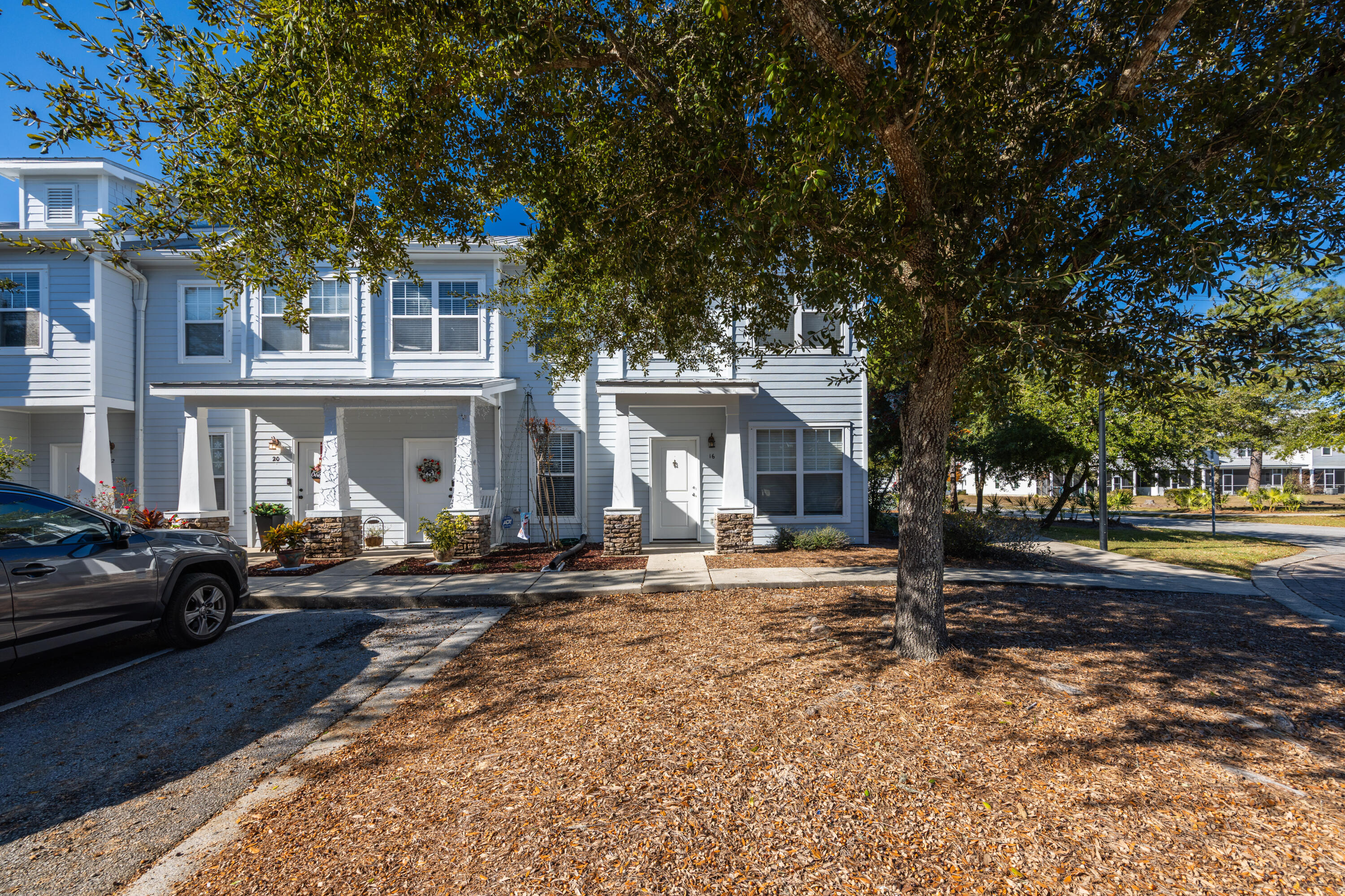 16 South Sand Palm Road Freeport, FL 32439 - Photo 25 of 32 a front view of a house with a yard