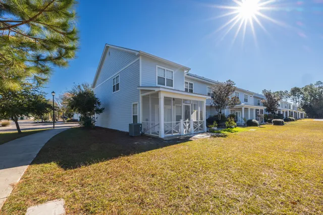 a front view of house with yard and trees