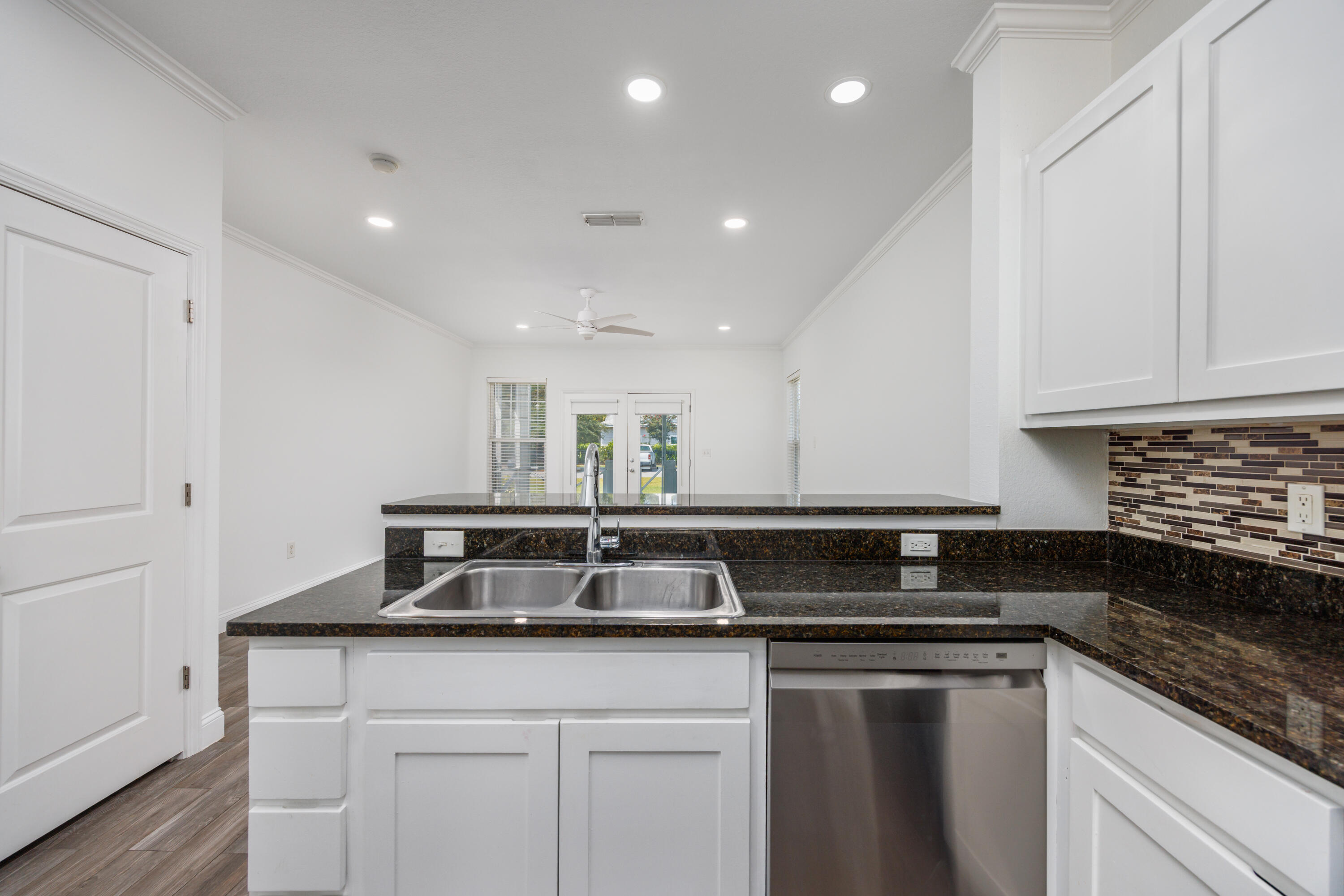 16 South Sand Palm Road Freeport, FL 32439 - Photo 7 of 32 a kitchen with a sink and cabinets