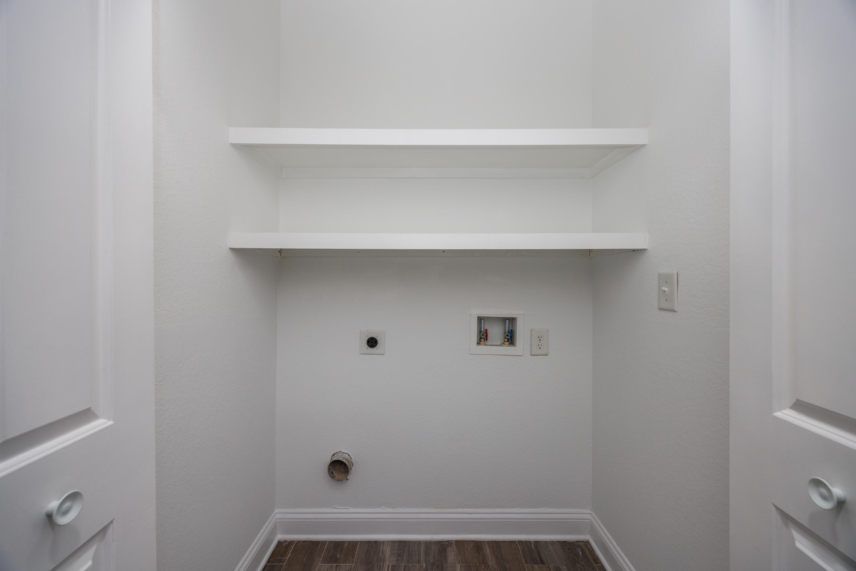 16 South Sand Palm Road Freeport, FL 32439 - Photo 9 of 32 a view of small space with racks on the wall