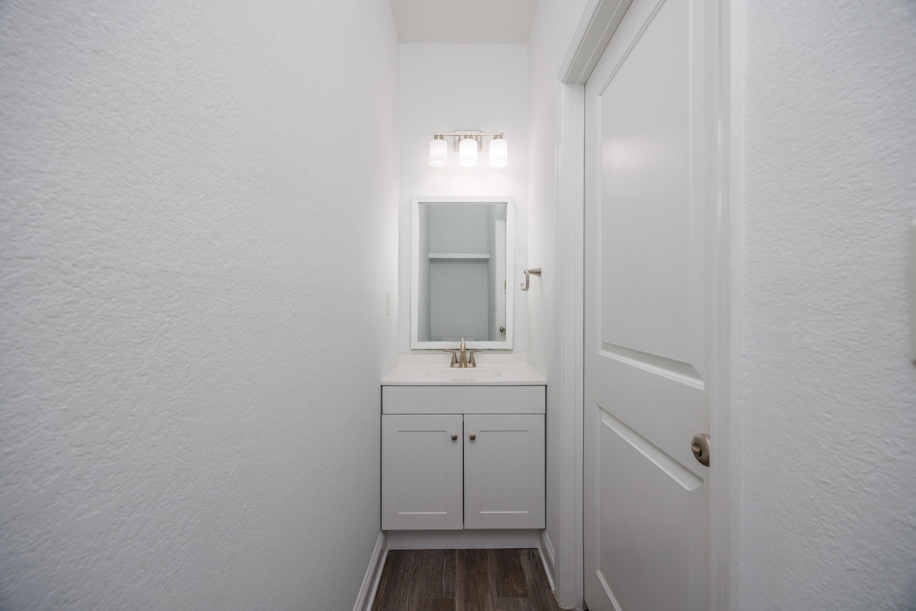 16 South Sand Palm Road Freeport, FL 32439 - Photo 10 of 32 a bathroom with a sink and a mirror