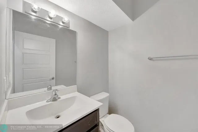 a bathroom with a sink a shower and a mirror