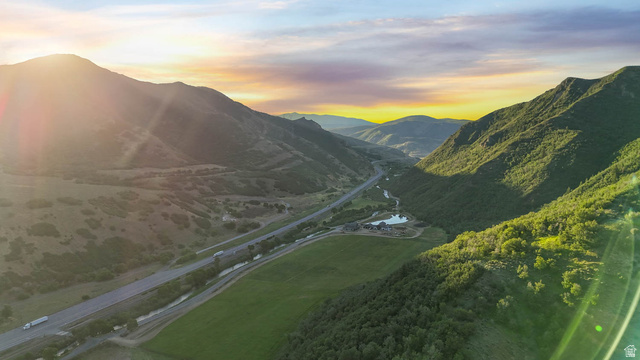 10686 South Covered Brg Cyn Road, Unit 14 Spanish Fork, UT 84660 - Photo 2 of 44 Expansive mountainous landscape featuring a valley with a highway, a river, and significant green space