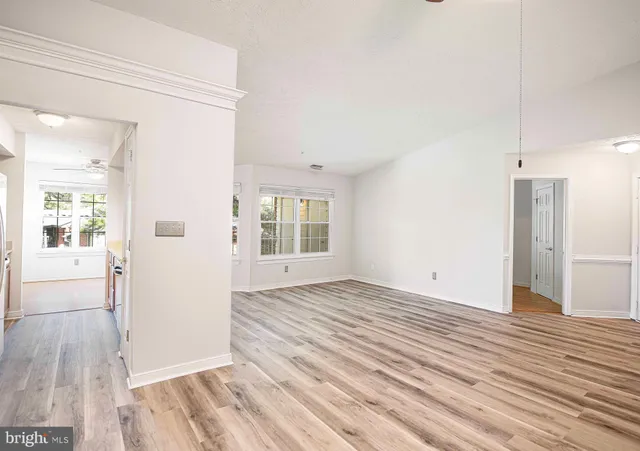 a view of a livingroom with wooden floor