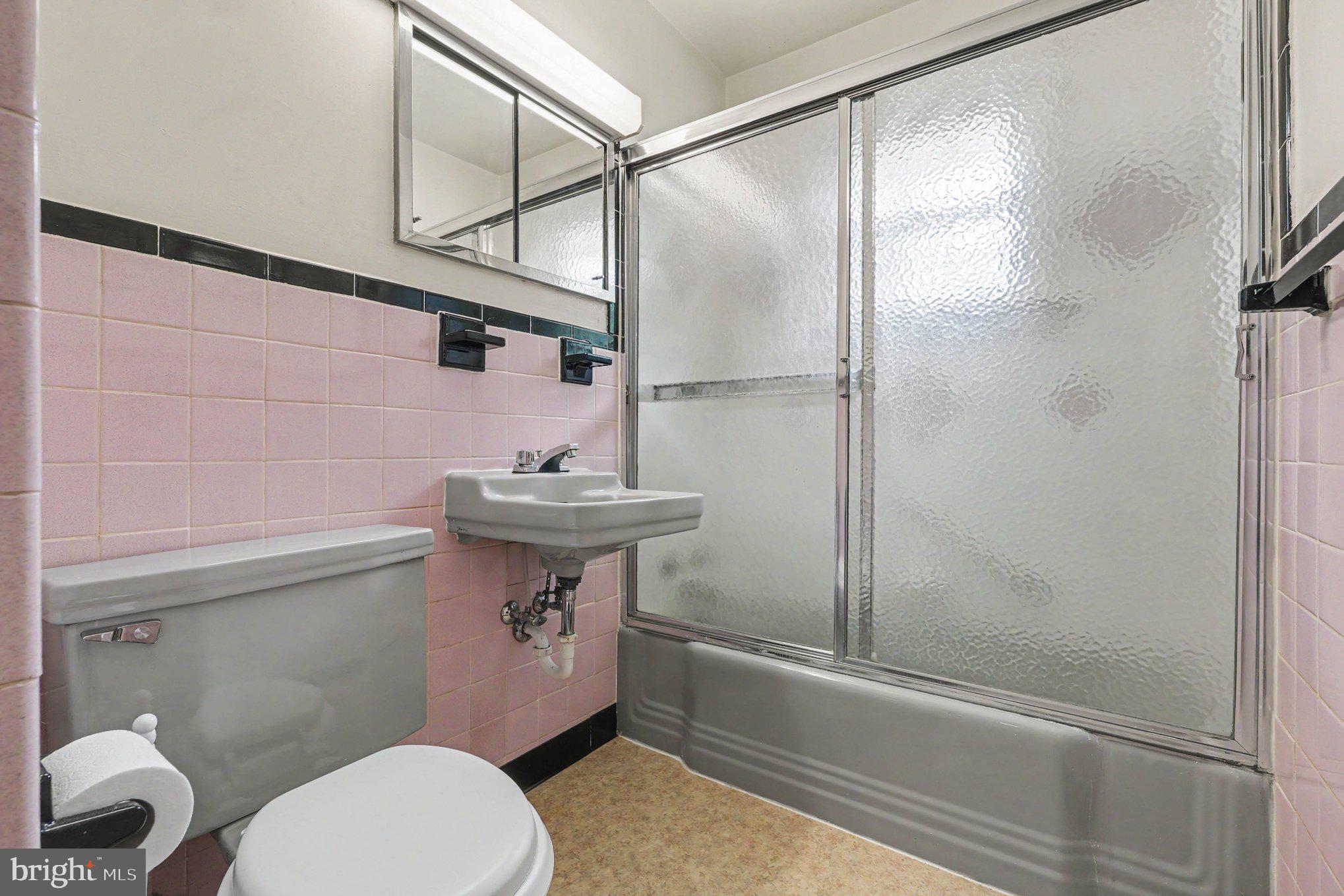 10218 Indiantown Road King George, VA 22485 - Photo 21 of 28 Charming vintage bathroom with pink tiles.