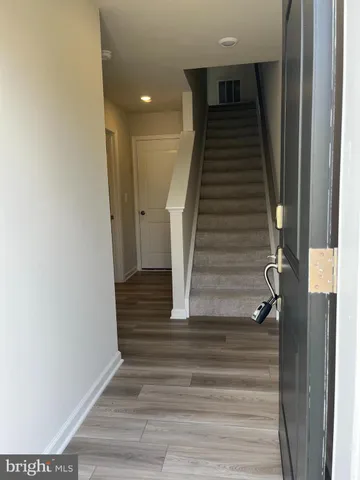 a kitchen with kitchen island granite countertop a sink a counter space and stainless steel appliances