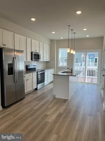 a view of a balcony with wooden floor