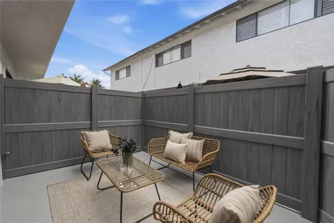 a balcony with table and chairs