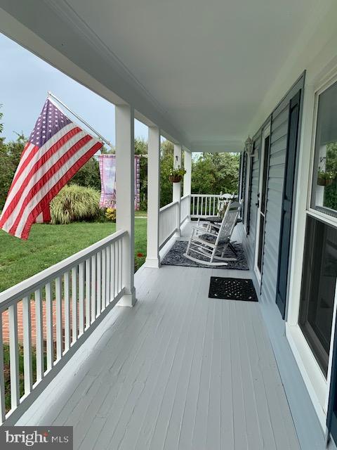 20260 Shelburne Glebe Road Purcellville, VA 20132 - Photo 2 of 14 Beautiful porch spanning entire front of home.