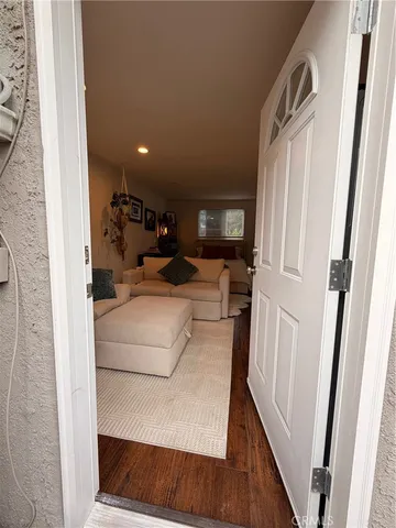 a view of living room with furniture and a fireplace