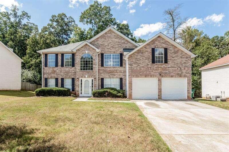 4805 Galleon Crossing Decatur, GA 30035 - Photo 1 of 1 a front view of a house with yard and garage