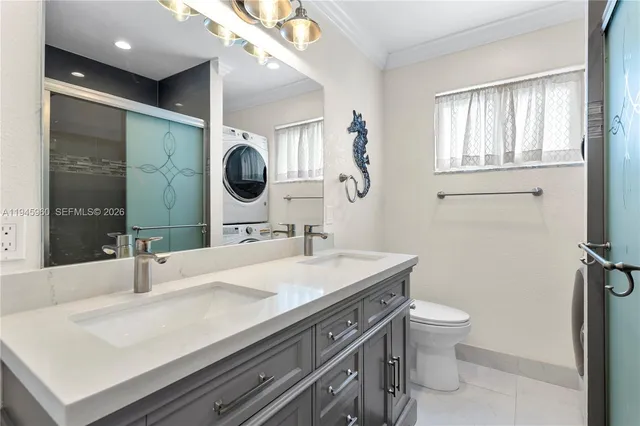 a bathroom with a sink vanity toilet and a mirror