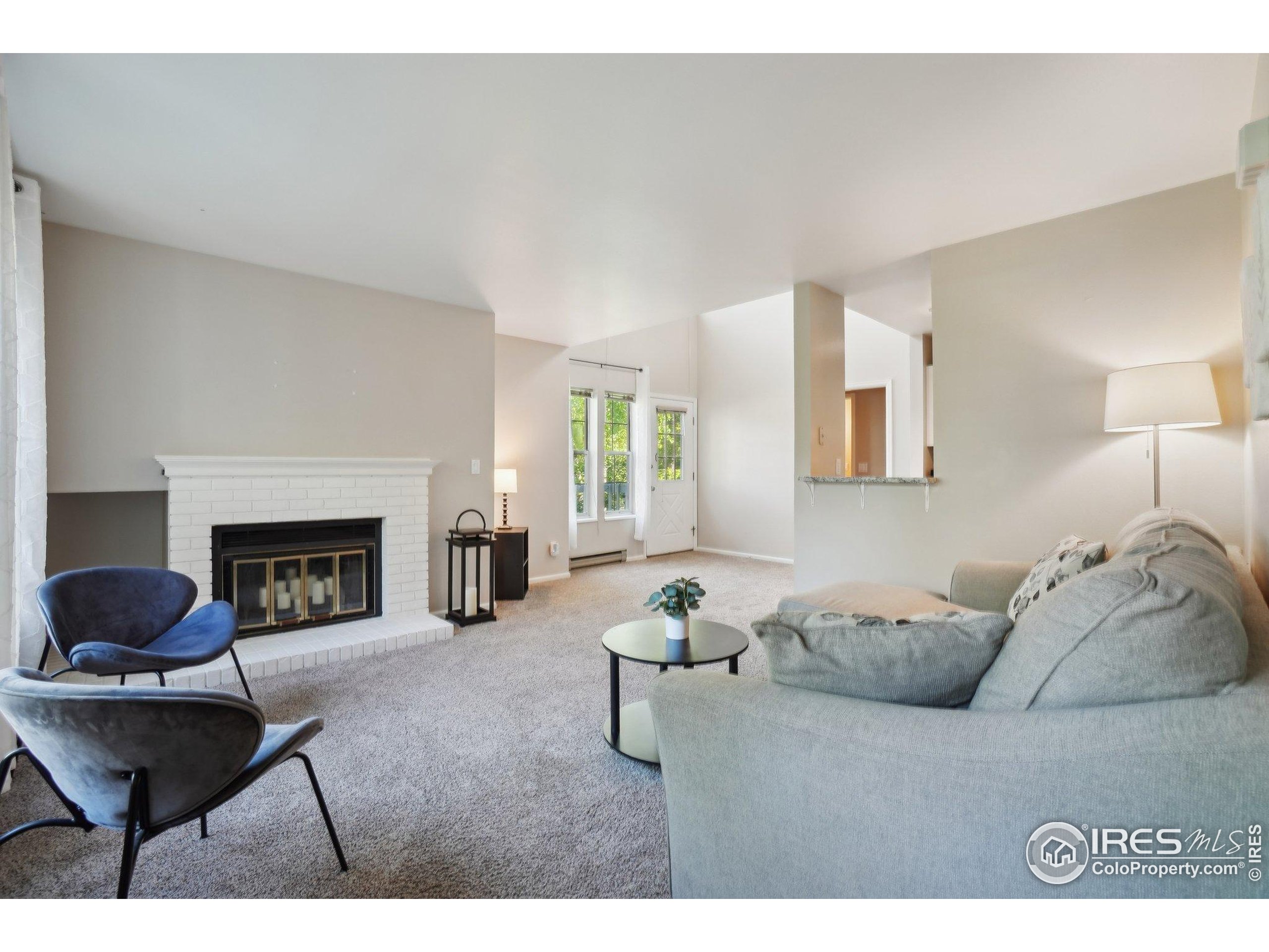1601 West Swallow Road, Unit 9 Fort Collins, CO 80526 - Photo 11 of 33 a living room with furniture and a fireplace