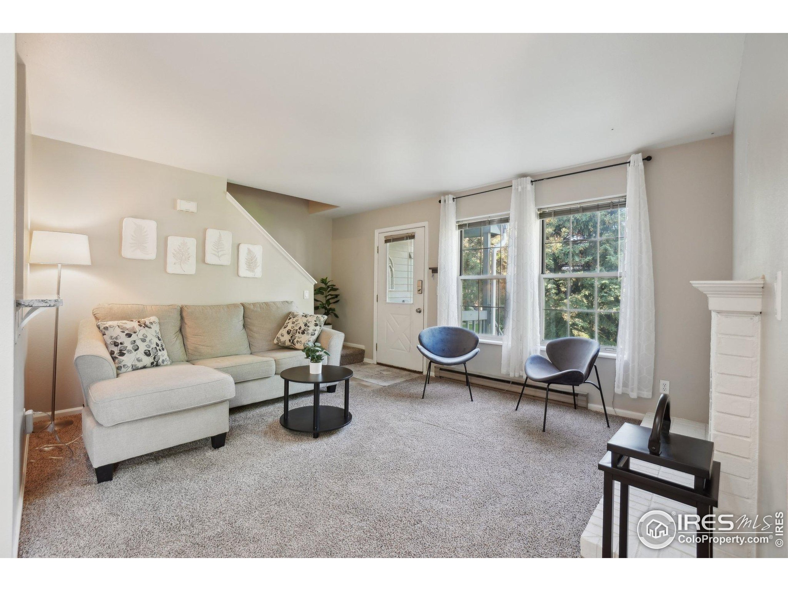 1601 West Swallow Road, Unit 9 Fort Collins, CO 80526 - Photo 12 of 33 a living room with furniture a rug and a window