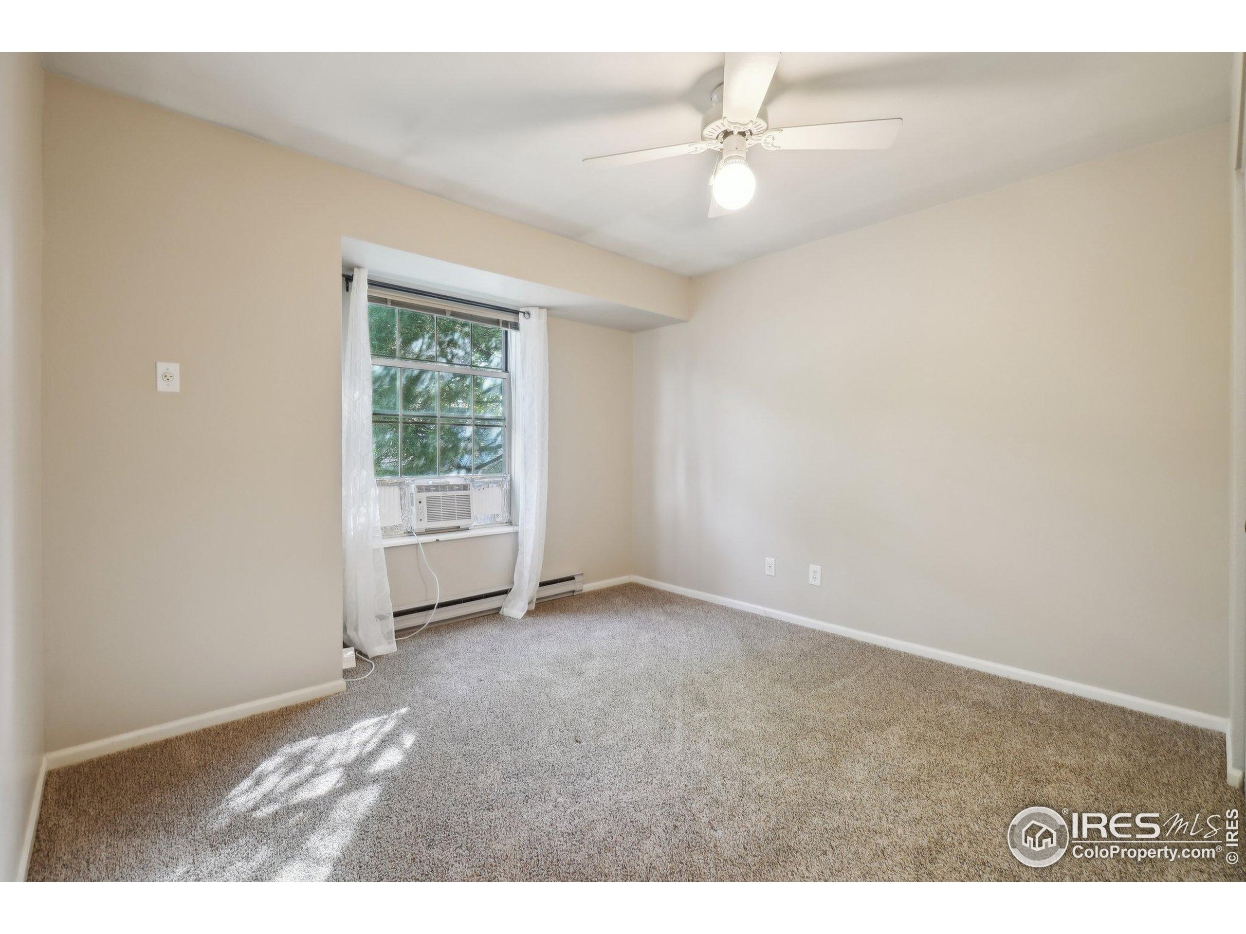 1601 West Swallow Road, Unit 9 Fort Collins, CO 80526 - Photo 19 of 33 a view of an empty room with a window