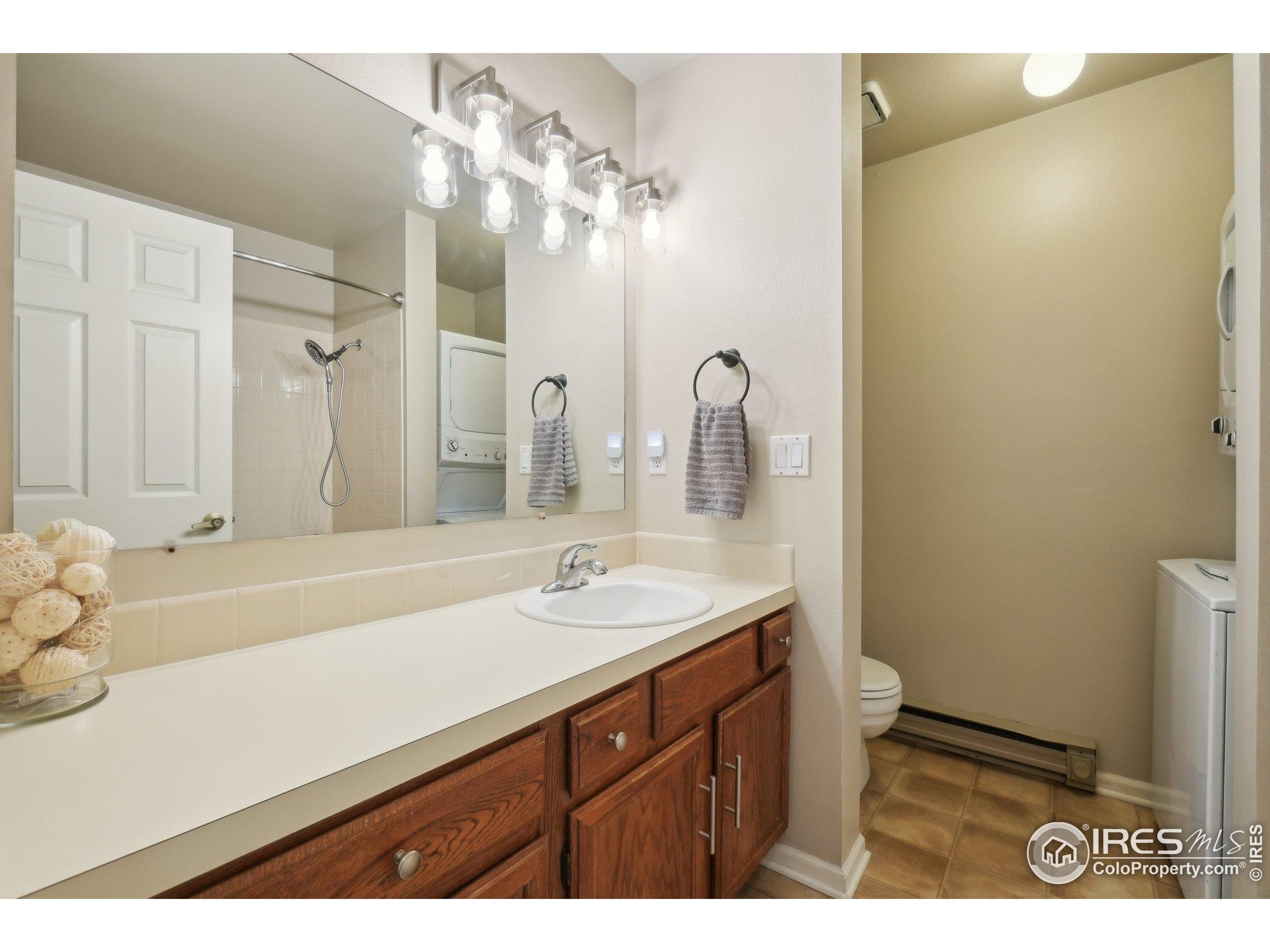 1601 West Swallow Road, Unit 9 Fort Collins, CO 80526 - Photo 20 of 33 a bathroom with a sink and a mirror