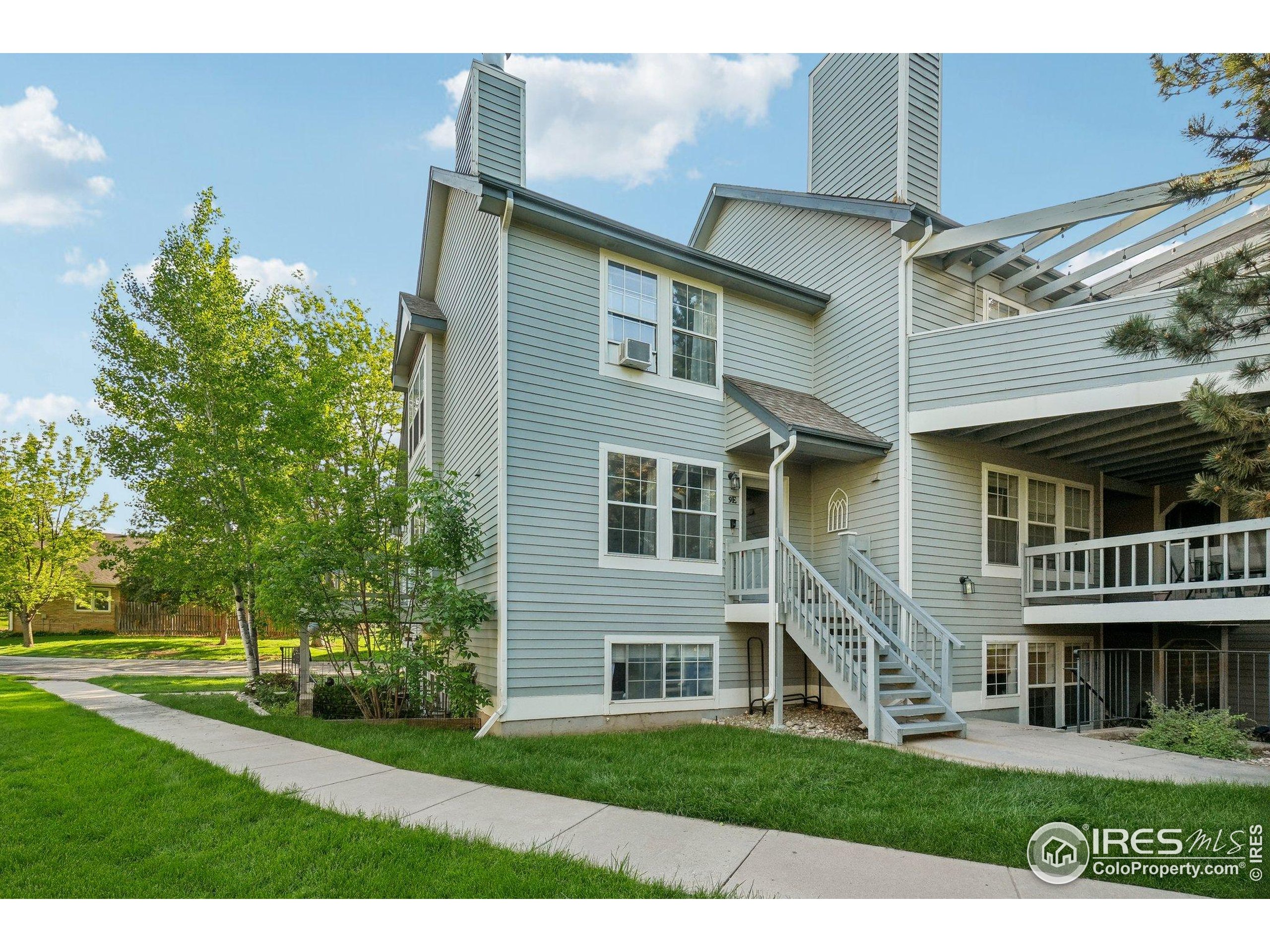 1601 West Swallow Road, Unit 9 Fort Collins, CO 80526 - Photo 2 of 33 a front view of a house with a yard