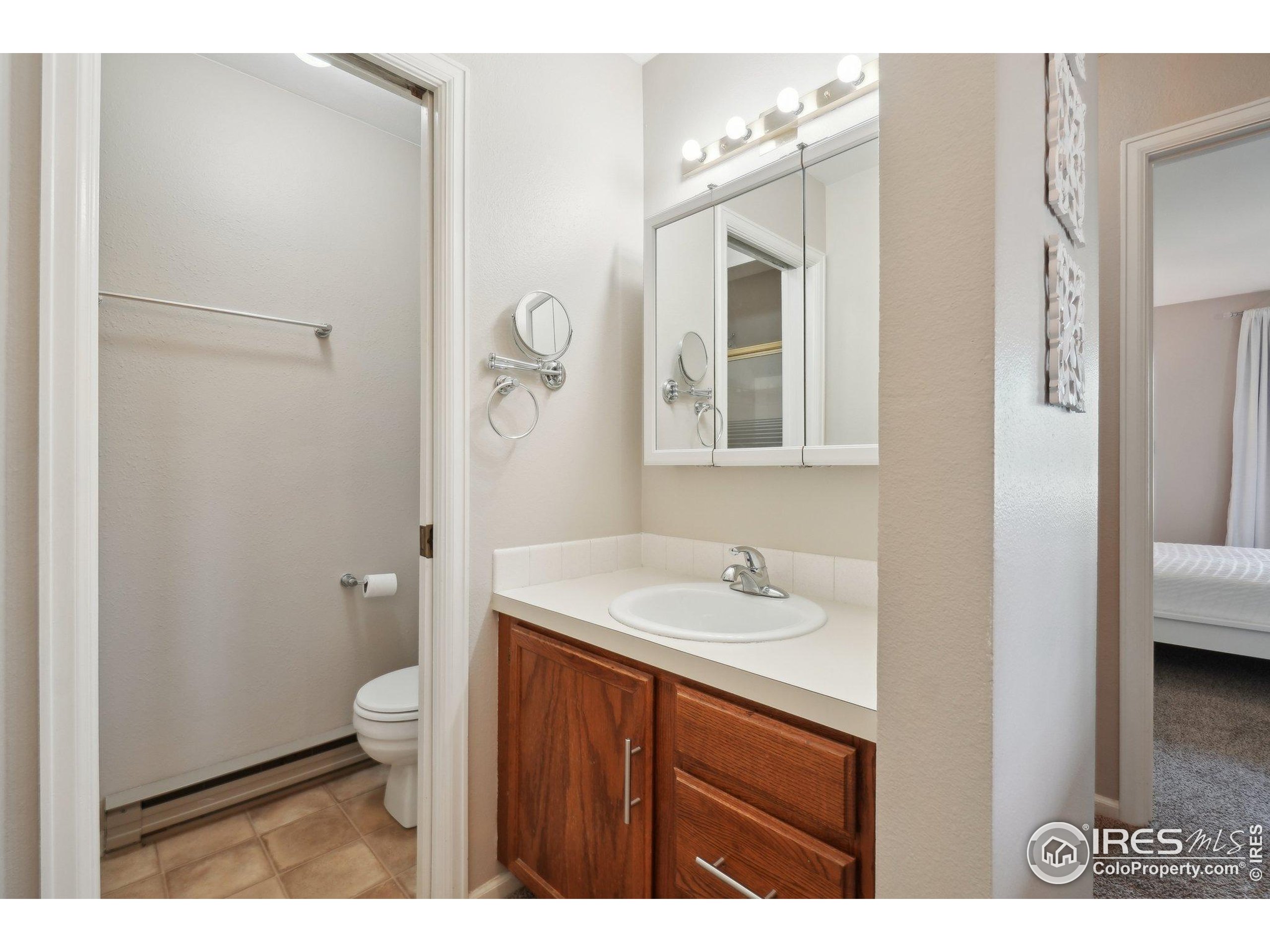 1601 West Swallow Road, Unit 9 Fort Collins, CO 80526 - Photo 26 of 33 a bathroom with a sink a toilet and shower