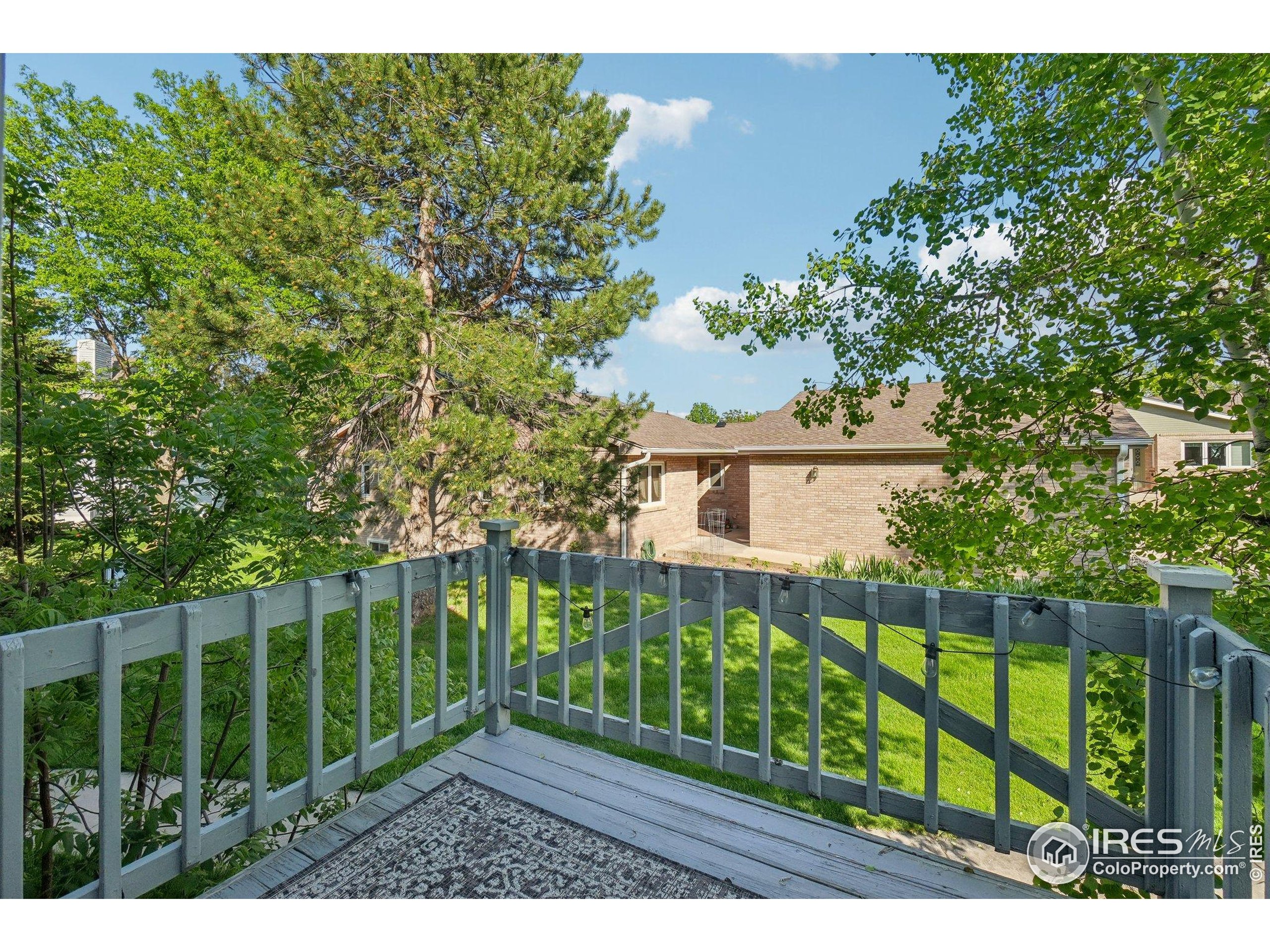 1601 West Swallow Road, Unit 9 Fort Collins, CO 80526 - Photo 28 of 33 a view of a fence in front of a house with a small yard