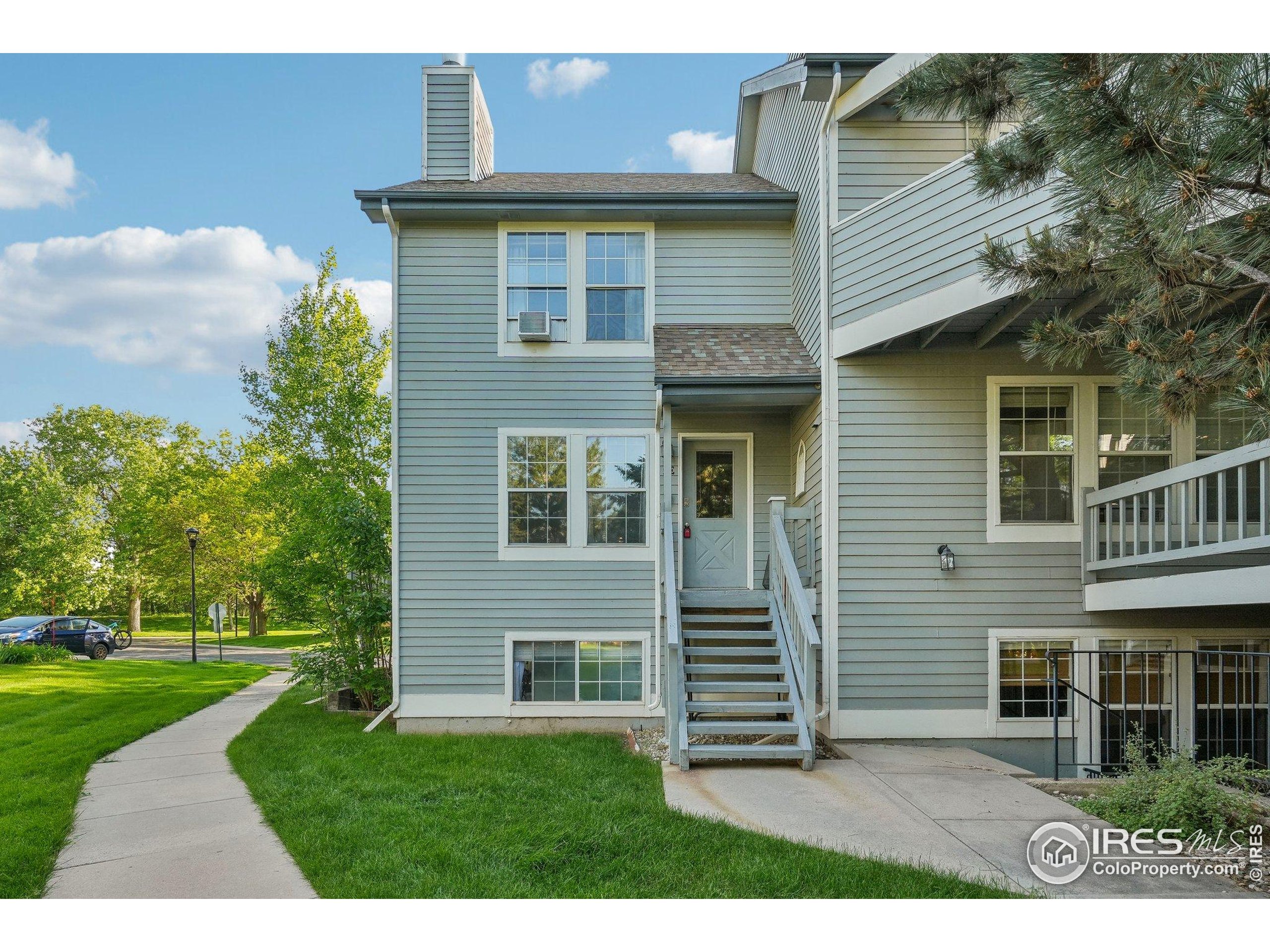 1601 West Swallow Road, Unit 9 Fort Collins, CO 80526 - Photo 4 of 33 a view of a house with a yard
