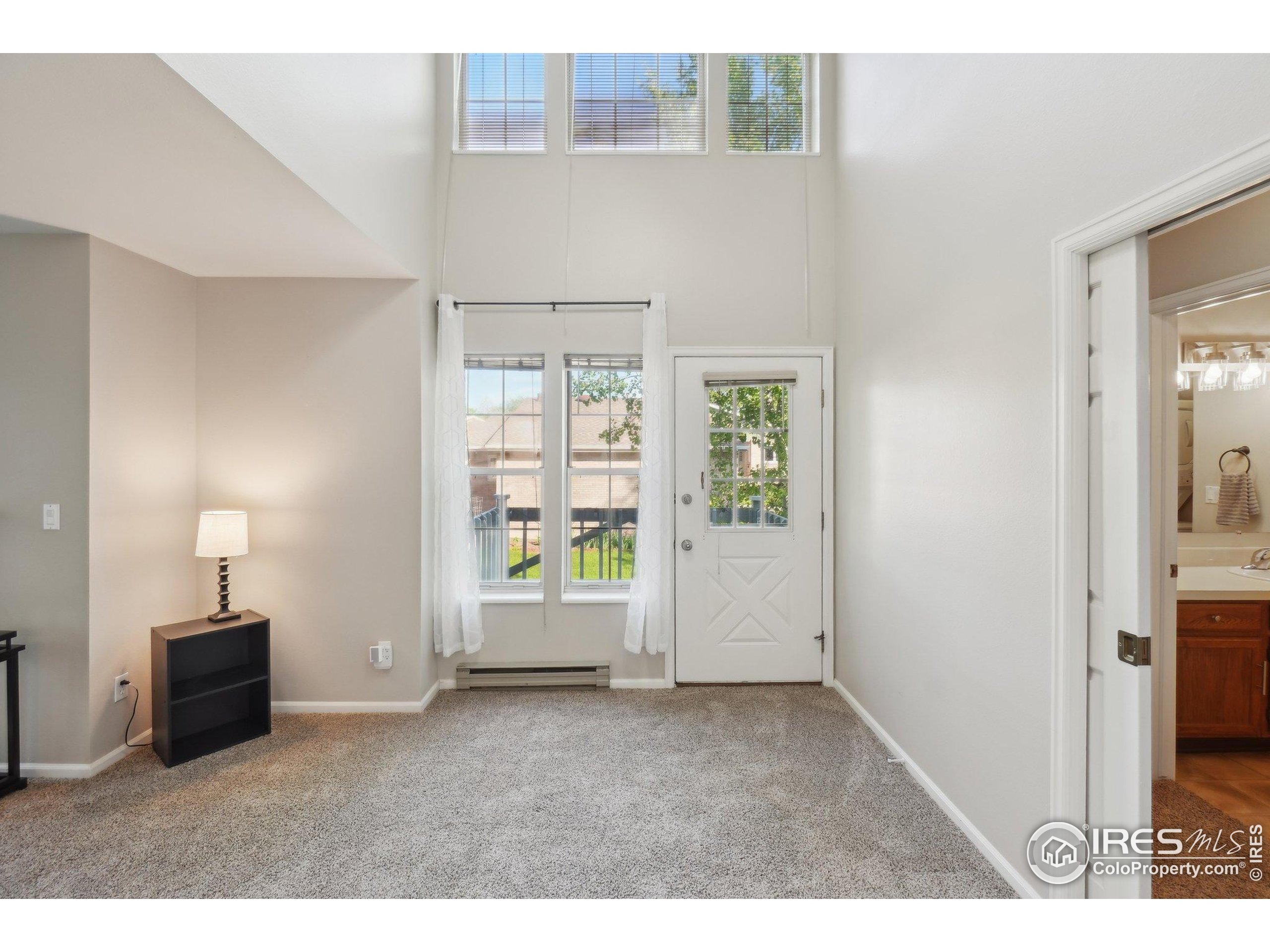 1601 West Swallow Road, Unit 9 Fort Collins, CO 80526 - Photo 10 of 33 a view of an empty room with a window