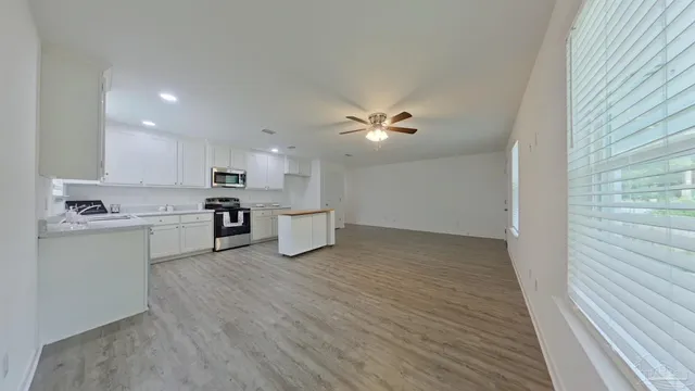 a view of kitchen with wooden floor