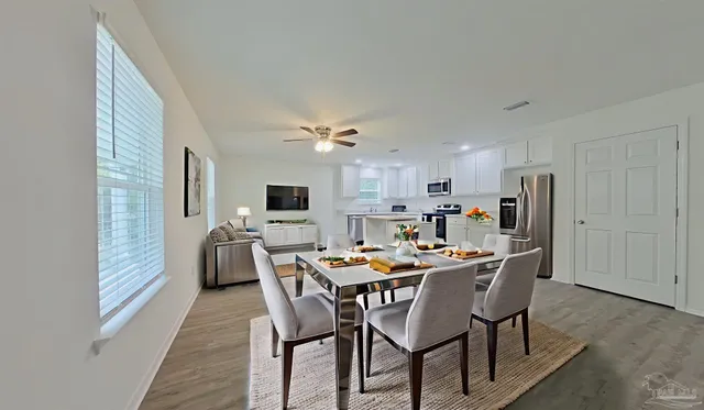 a dining room with furniture and window