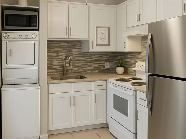 a kitchen with white cabinets and white appliances