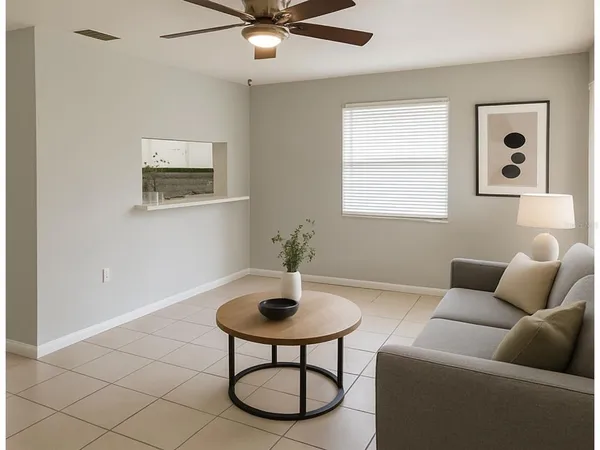 a living room with furniture and a window
