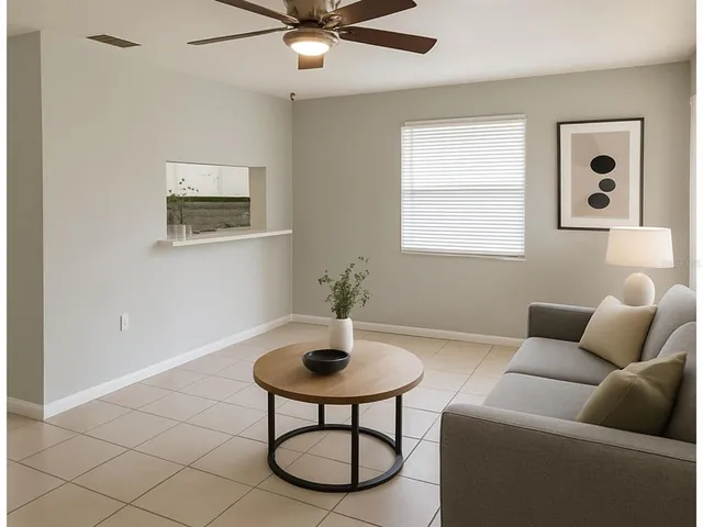 a living room with furniture and a window