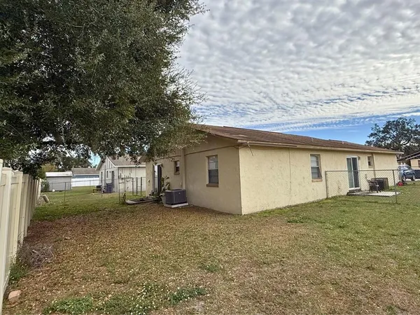 a house that has a tree in front of it