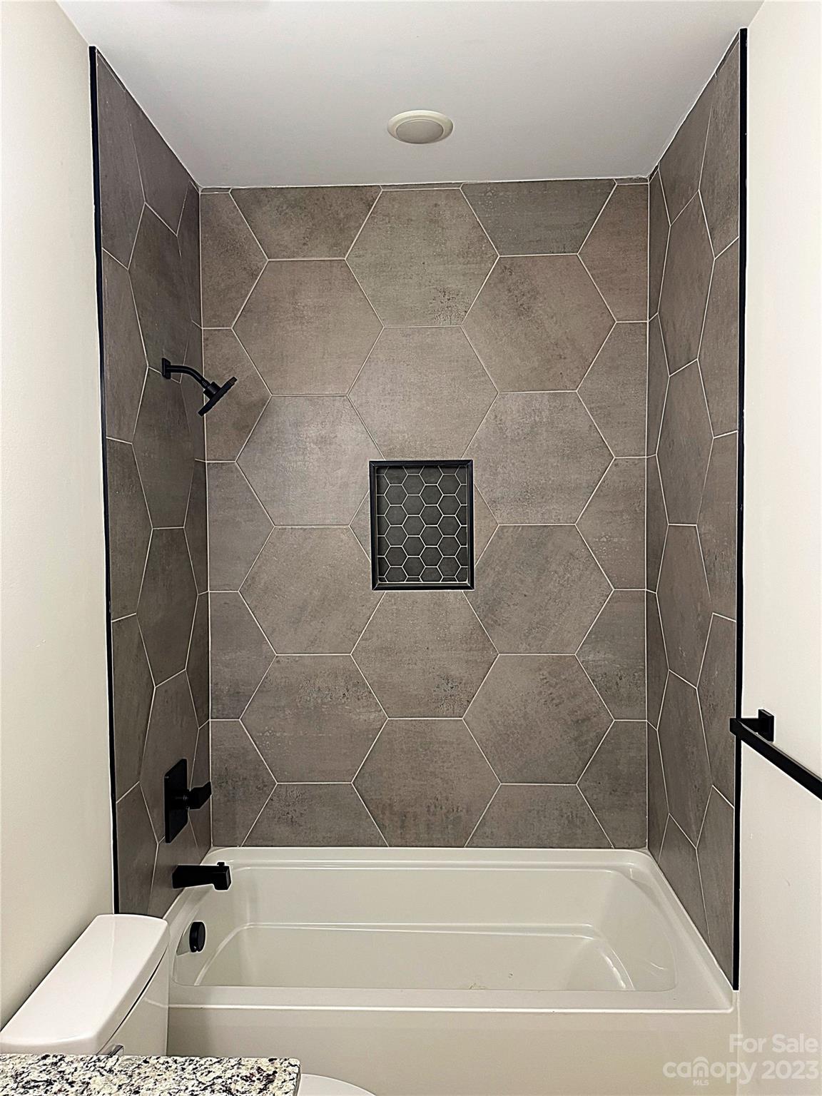 2208 Moose Road Kannapolis, NC 28083 - Photo 5 of 8 a bathroom with a bathtub and a shower