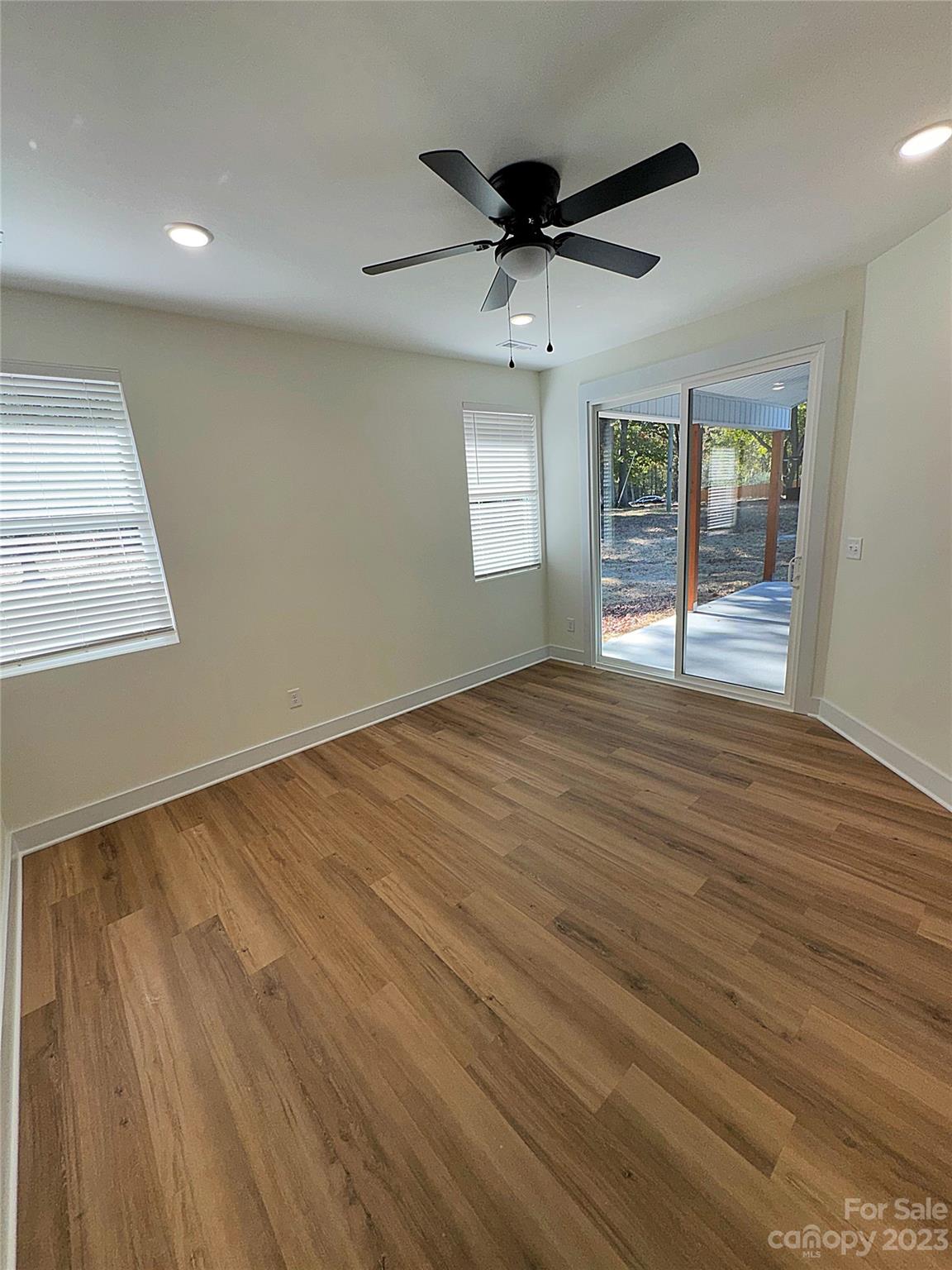 2208 Moose Road Kannapolis, NC 28083 - Photo 6 of 8 a view of an empty room with wooden floor and a window