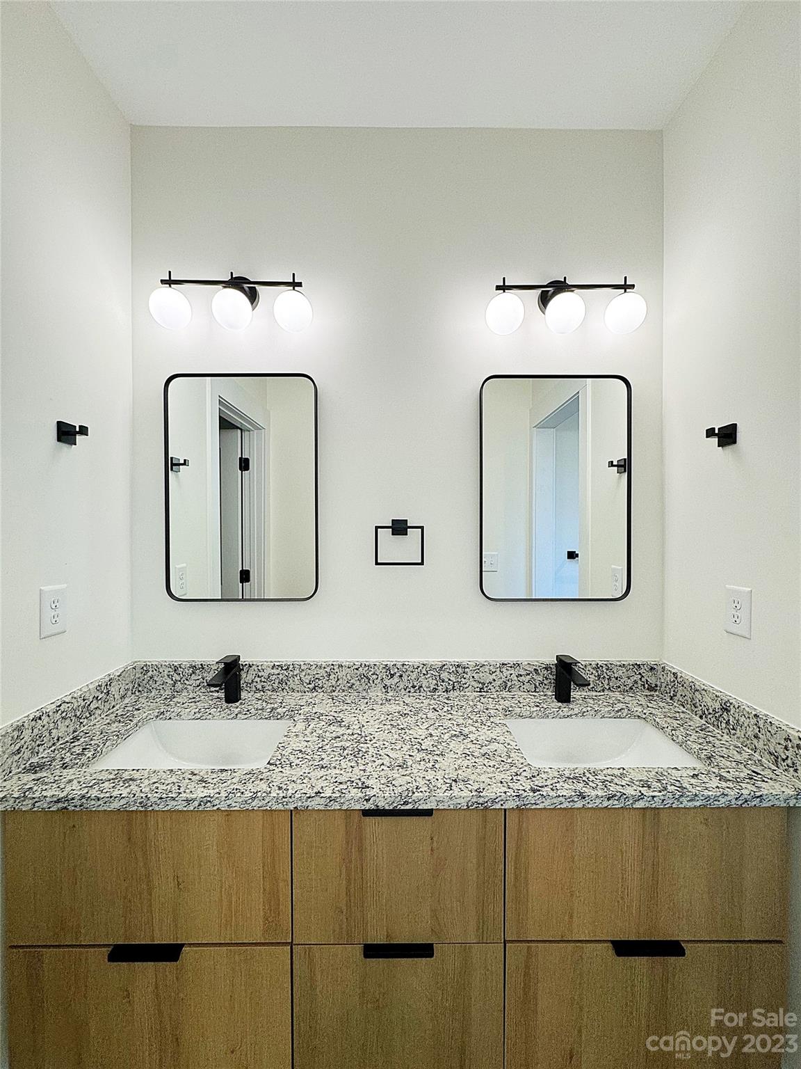 2208 Moose Road Kannapolis, NC 28083 - Photo 7 of 8 a bathroom with a granite countertop sink and a mirror