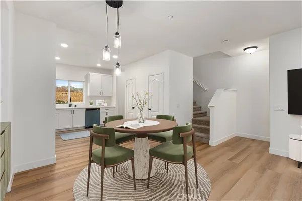 a view of kitchen with cabinets and wooden floor