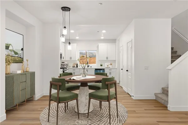 a kitchen with a refrigerator stove and microwave