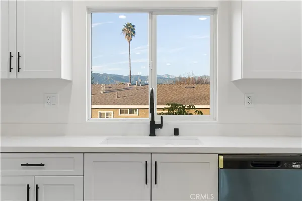 a view of a chair and table in a kitchen