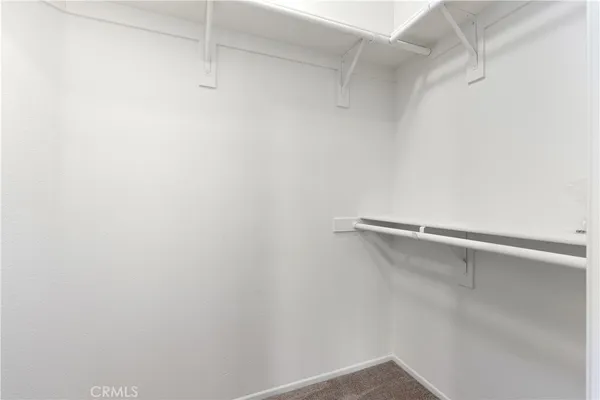 a bedroom with bed and wall painting