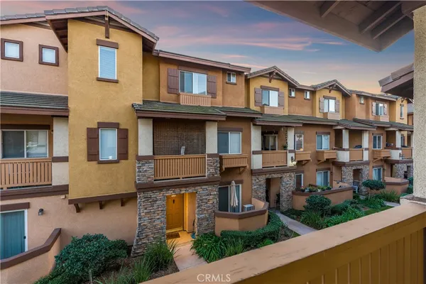 a view of a building with a yard