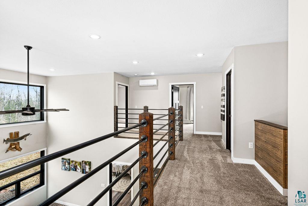 5174 Upper Peterson Road Duluth, MN 55804 - Photo 15 of 42 Corridor featuring an upstairs landing, dark colored carpet, and recessed lighting