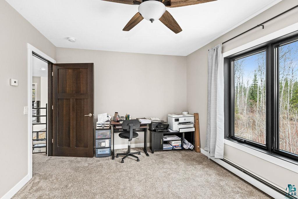 5174 Upper Peterson Road Duluth, MN 55804 - Photo 18 of 42 Office area with a ceiling fan, light colored carpet, and a baseboard radiator